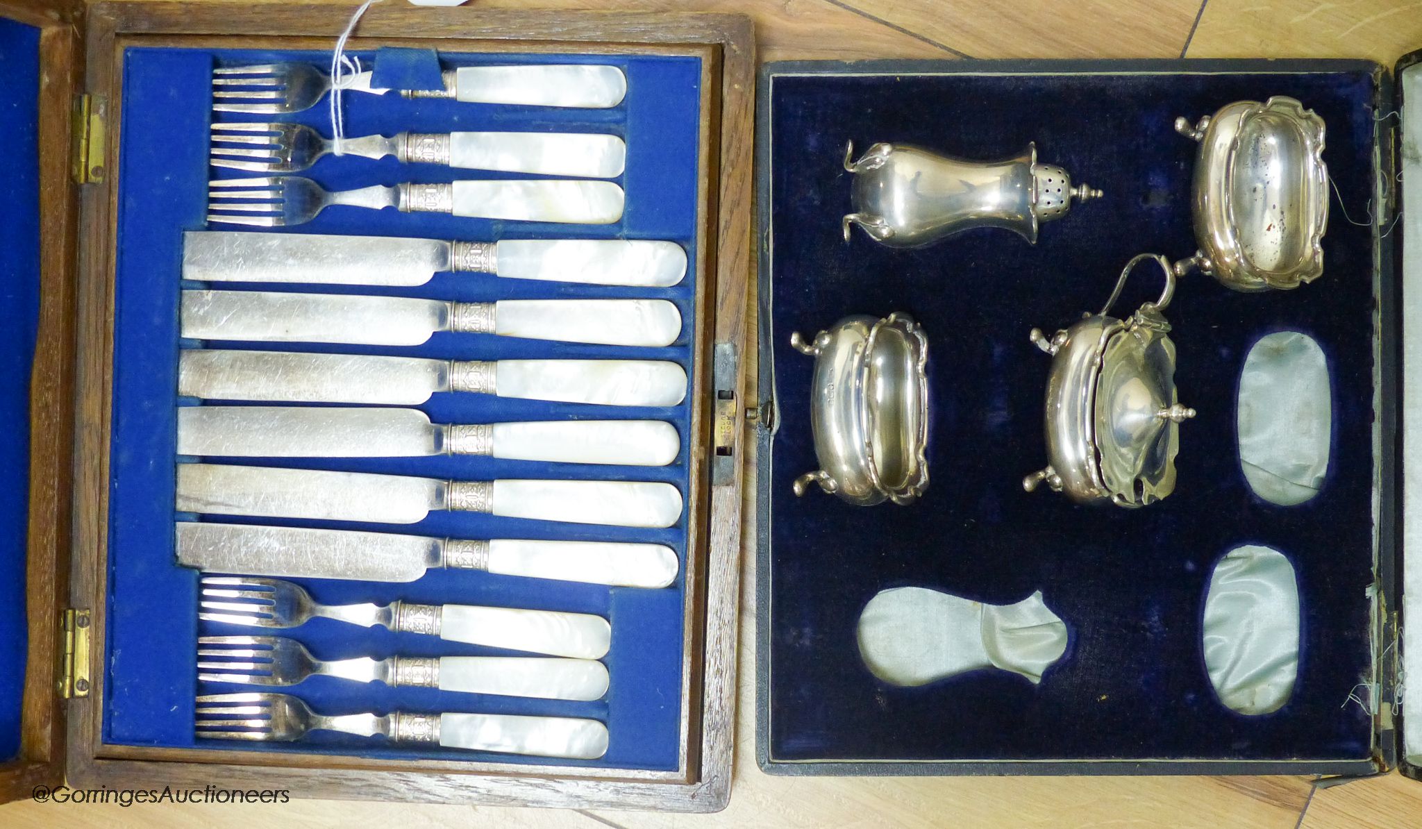 A cased part set of condiments and a cased set of plated fish knives and forks